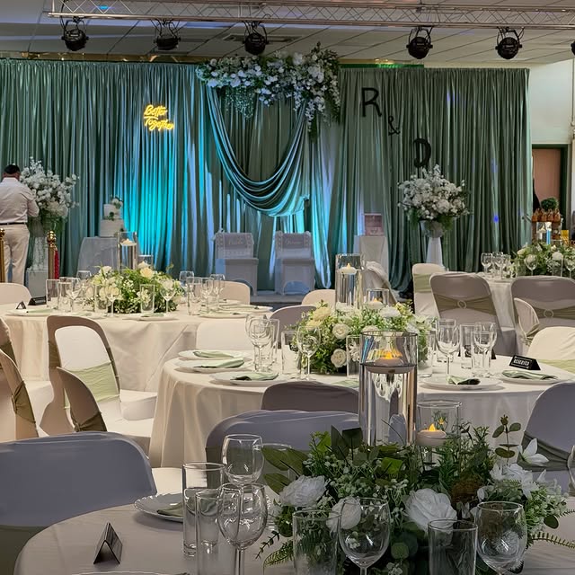 Banquet hall styled by Home Chef UK with dressed tables, florals, draping and candlelight in London
