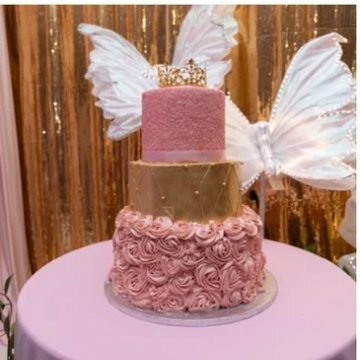 Pink rosette celebration cake with gold tier