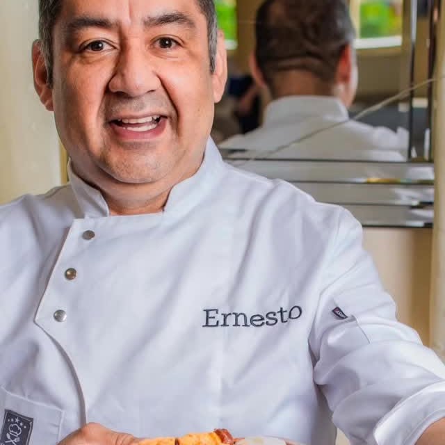 Chef Ernesto Leon of Home Chef UK in his chef whites at an event