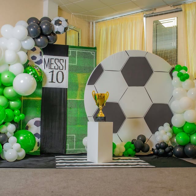 Football themed children's party set-up with balloon arch by Home Chef UK
