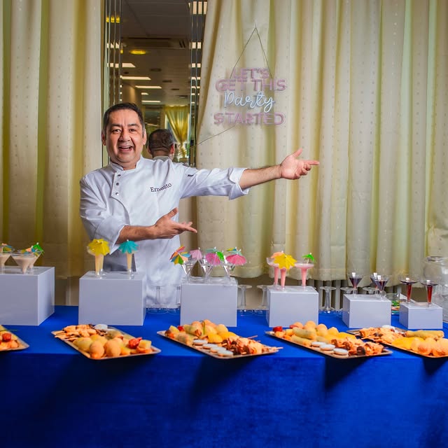 Chef Ernesto presenting a canapé and dessert display