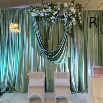 Draped satin backdrop and floral arch created by Home Chef UK